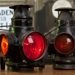 AT&SF marker lamps, kerosene, fitted by the rr with electric lamp holders (ergo no burners). Santa Fe markers typically showed red to the rear and amber to the sides and front. Purchased from a collectables dealer circa 1990. The cords are not original. Generous gift of Gordon Bachlund.