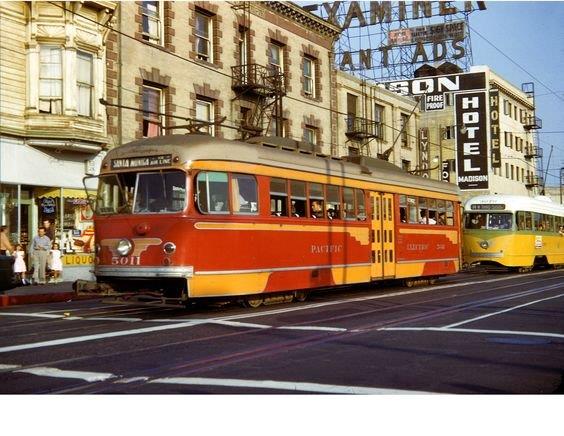 This remarkable photo was taken during a fan trip operated on October 12, 1952. The photo is on 7th Street between San Pedro and Main Streets. The PE maintained track on 7th for movements of cars into the 7th Street Surface Yard and back out onto Main Street. This was the only place in the world such a photo could be taken. Here we see 2 PCCs of different manufacturers, 2 different gauges and 2 different railway companies. Only 2 other American cities operated 2 different PCC rail systems, they being the Shaker Heights Rapid Transit System and the Cleveland Transit System in Ohio and the Illinois Terminal Railroad and the St. Louis Public Service. The PCCs of these 2 systems operated in different parts of both cities.
